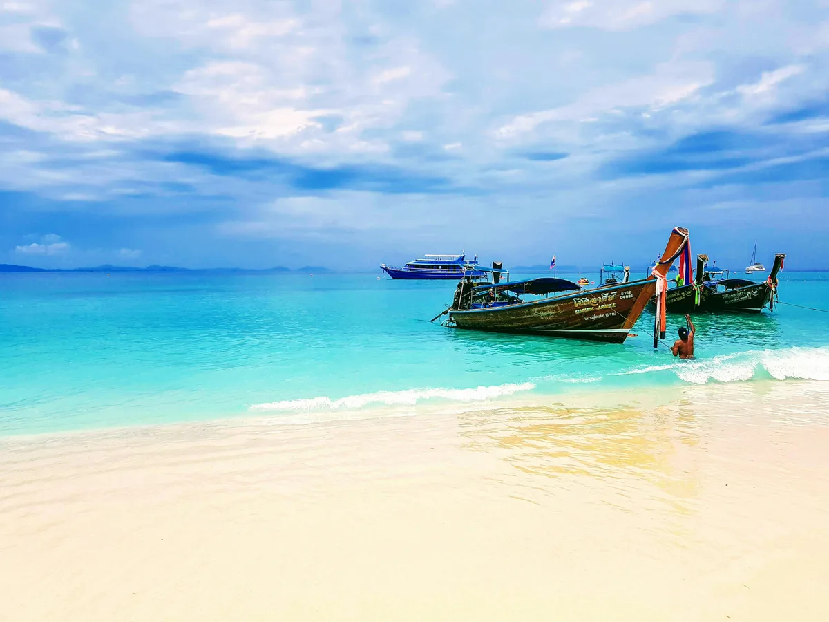 Two boats in the shores of Bamboo Island in Krabi